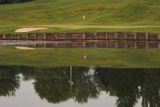 A view over the water of a hole at Brook Hill Golf Club