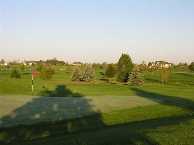 A sunny view of a hole at Emerald Greens Golf Club