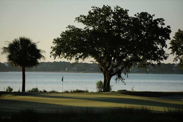 A view of a green with water in background at Haig Point Club