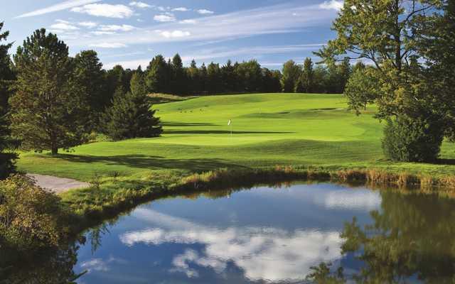 A view over the water of hole #7 at The Spruce Run Course from Grand Traverse Resort & Spa