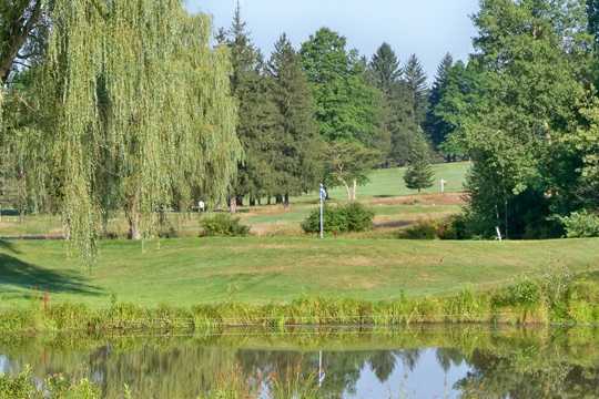 A view over the water of a green at DuBois Country Club