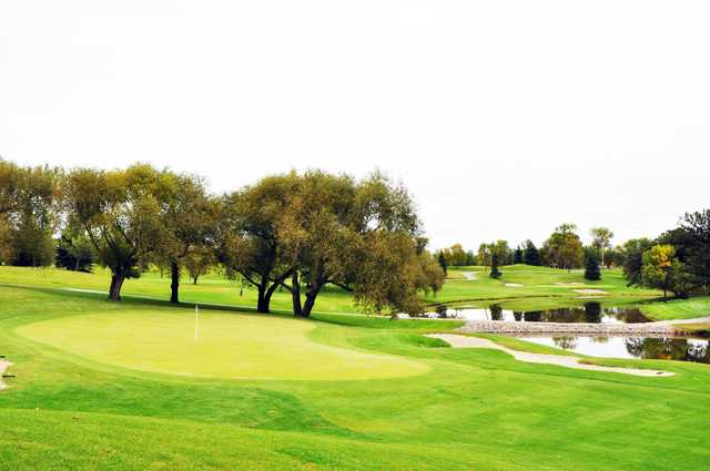 A view of a hole with water and bunkers coming into play at Oxbow Golf & Country Club