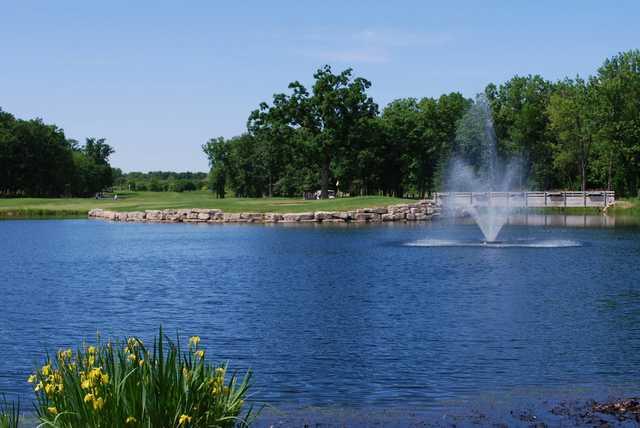 A view of a hole with a water fountain in foreground at Cantigny Golf