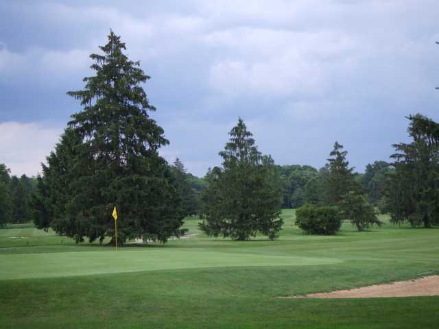 A view of a green guarded by a bunker at Peddie Golf Club.