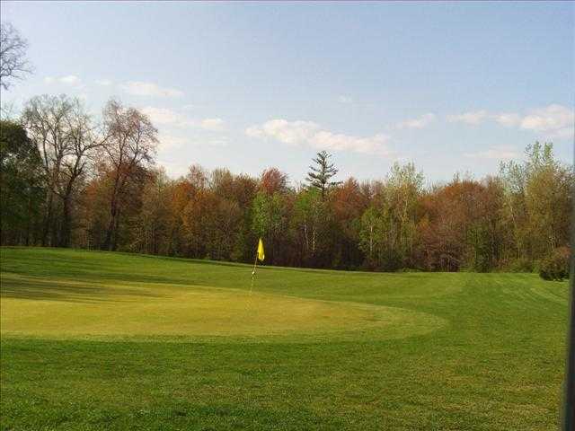 A fall view of a green at Big Oak Golf Course