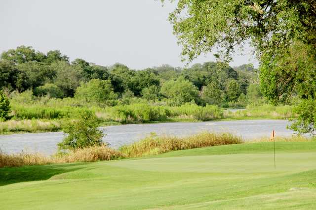 A view of a green with water coming into play at Llano River Golf Course
