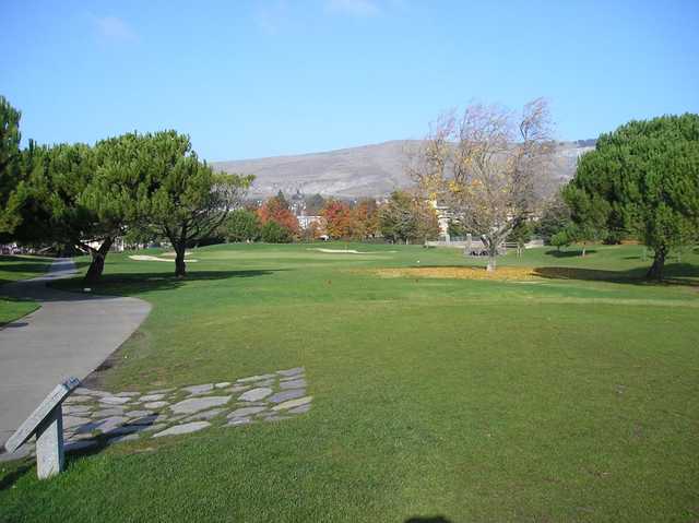 A view of a green protected by sand traps at Mission Hills of Hayward Golf Course