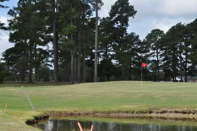 A view of a green with water coming into play at Holly Hill Golf Club