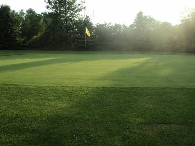 A sunny day view of a green at Summer Breeze Par 3