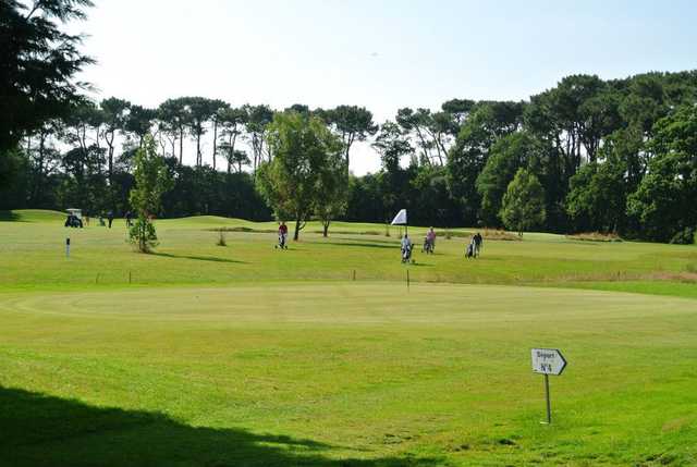 A sunny day view of a hole at Guerande Golf Club