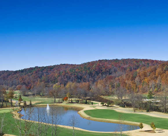 A view of a green near the lake at Achasta Golf Club