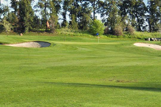 A view of a hole protected by bunkers at Arcade Creek from Haggin Oaks Golf Course