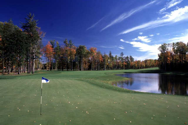 A view of a hole guarded by fall trees at Black Lake Golf Club