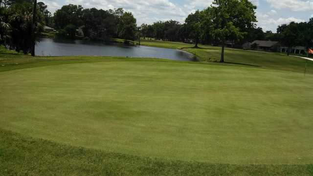 A view of a green with water coming into play at Sherwood Golf Club