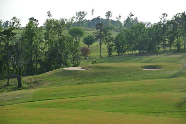 A view of a green flanked by bunkers at Eagle's Nest Golf Course from Lake Guntersville State Park