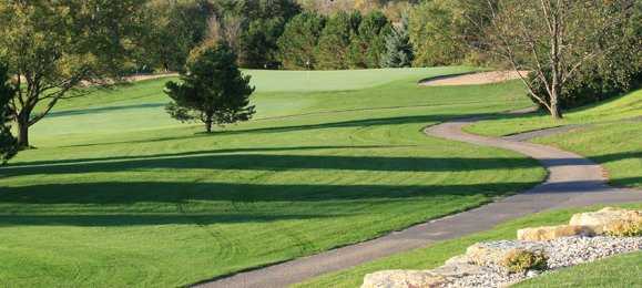 A view of a green protected by bunkers at Baraboo Country Club