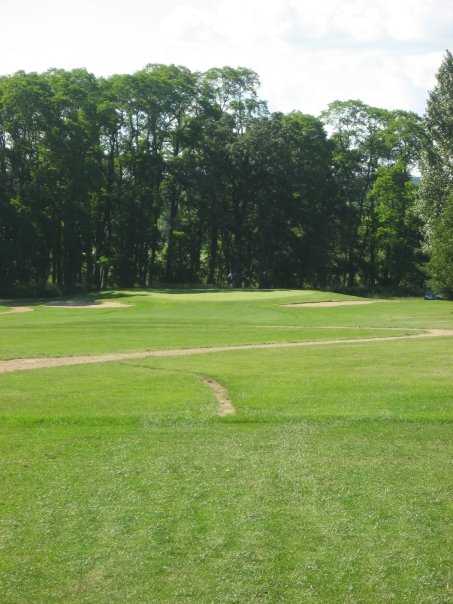 A view of a green protected by bunkers at  Blue from Coachman's Golf Resort.
