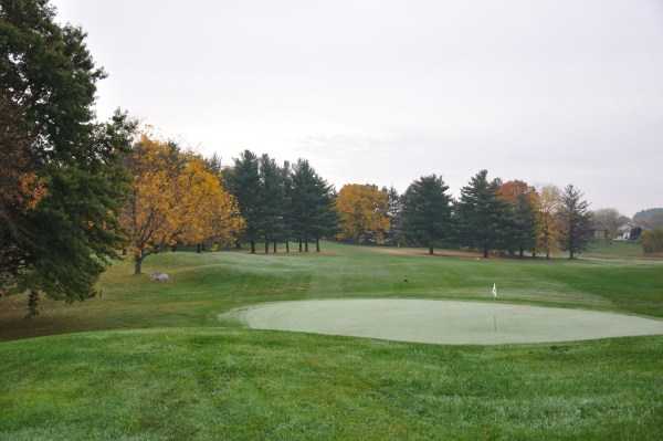 A fall view of a green at Lake Mills Golf Course