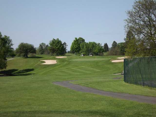 A view of a fairway and a green protected by bunkers at Hidden Valley Golf Club
