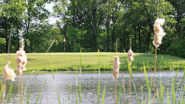 A view of a green with water coming into play at Arrowhead Heights Golf Course
