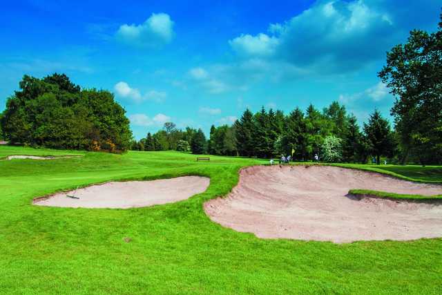 A view of a green protected by bunkers at Pype Hayes Golf Club