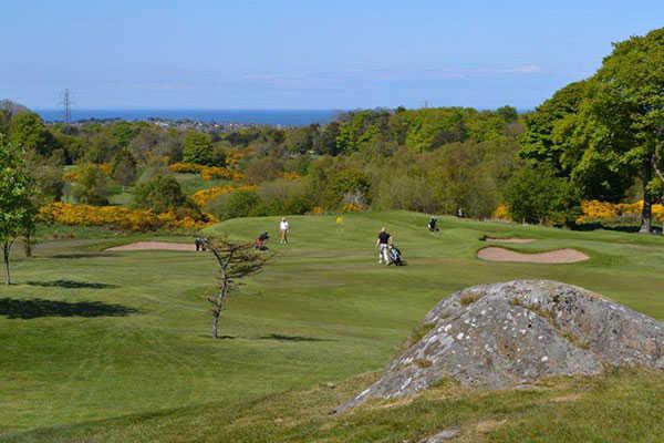 A view of a green protected by bunkers at Clandeboye Golf Club