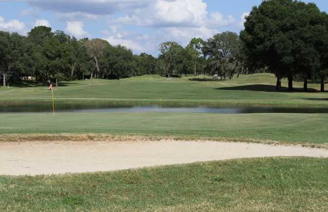 A view of a green with water coming into play at Citrus Hills Golf & Country Club