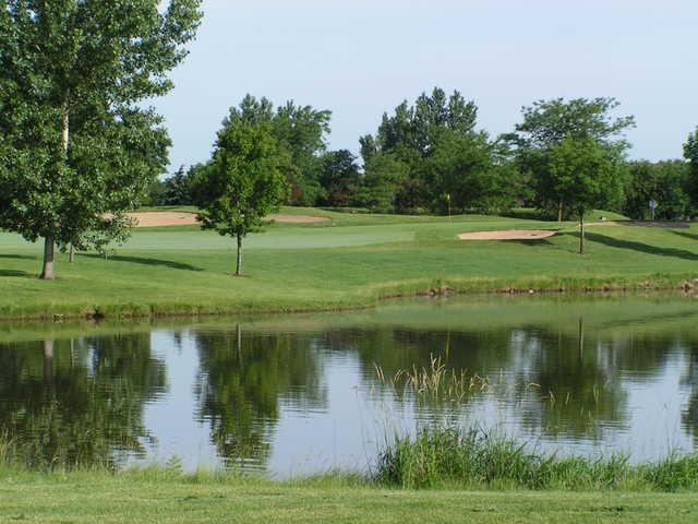 View of a hole and pond at Tamarack Golf Club