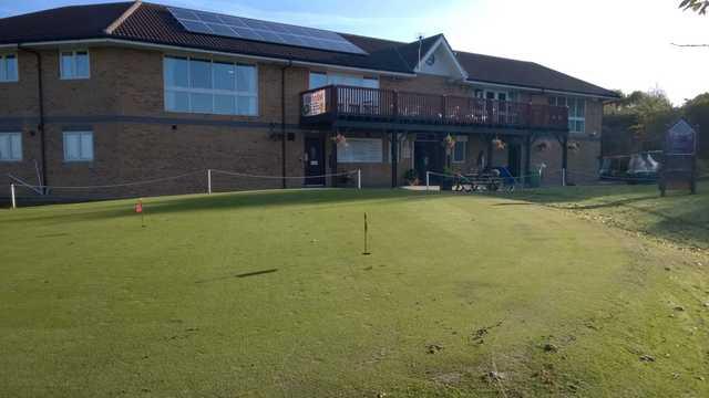 The clubhouse and putting green at Ravensworth Golf Club