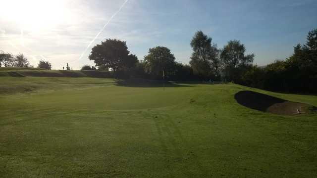 Viiew of the sun setting on the 15th green at Ravensworth Golf Club