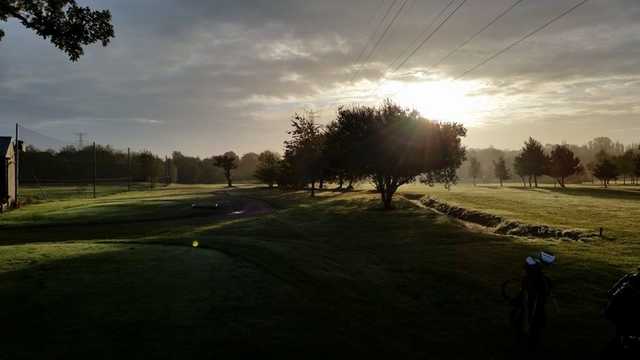 Sun shining over the fairway at Widney Manor Golf Club