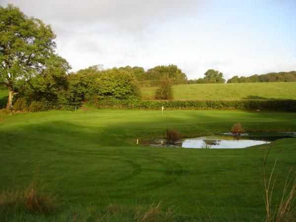 View of the well protected 4th green at Coed-y-Mwstwr Golf Club
