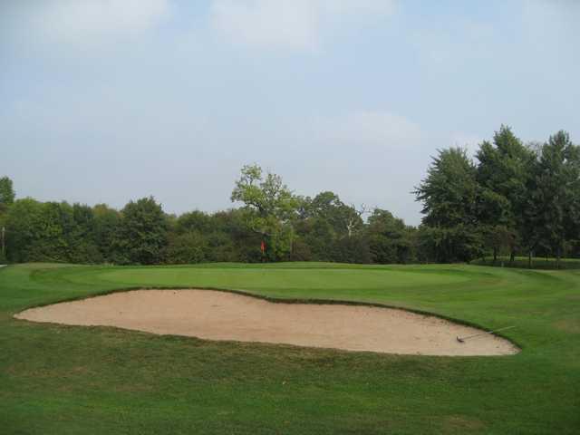 The 16th green and greenside bunker at Oakridge Golf Club