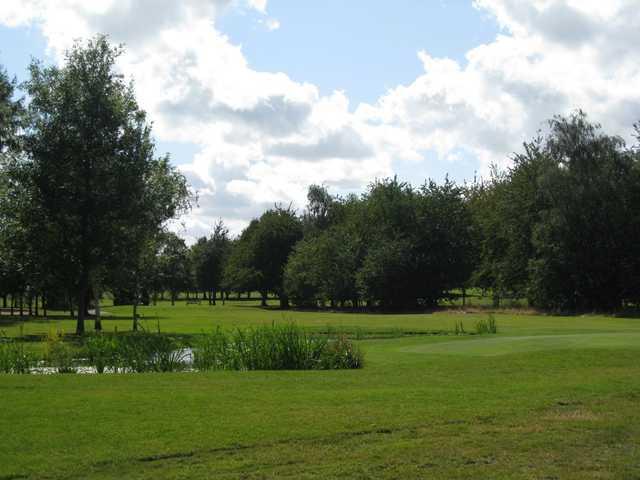 Scenic view of the 6th hole and pond at Shrewsbury Golf Club