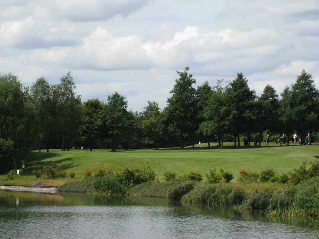 A view of the challenging 16th green and accompanying water hazard at Bromsgrove GC