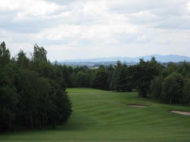 The 2nd fairway and green with surrounding trees at Bromsgrove Golf Course