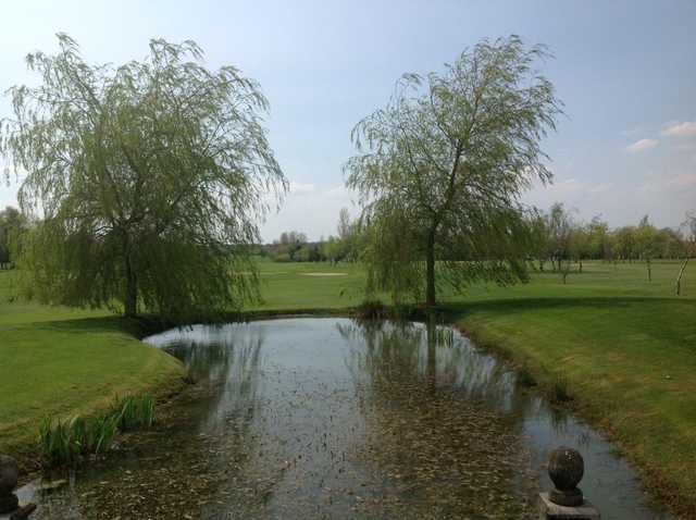 View of the course and water hazards at Six Hills Golf Club