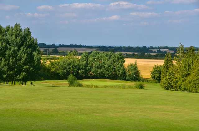 Scenic view of the 17th hole and surrounding countryside at Chippenham Golf Club