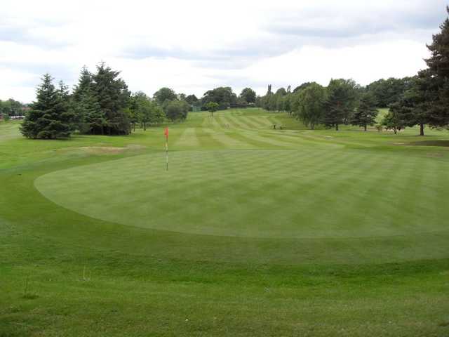 The well-manicured but sloping 17th green at Romiley