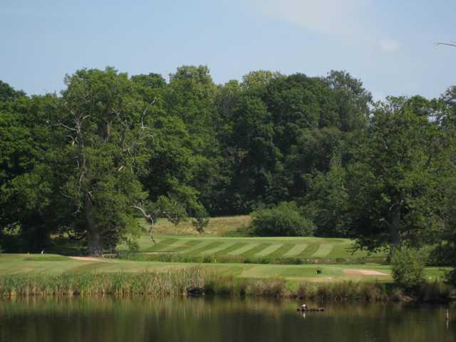 A view across the pond of the 8th hole at Henlle Park