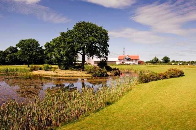 A view of the clubhouse over one of the many water hazards around the course