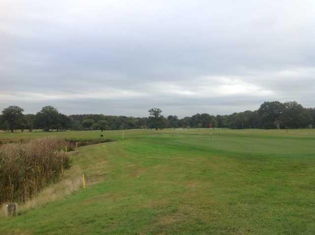 View of the 18th green and surrounding trees at Royal Ascot Golf Club