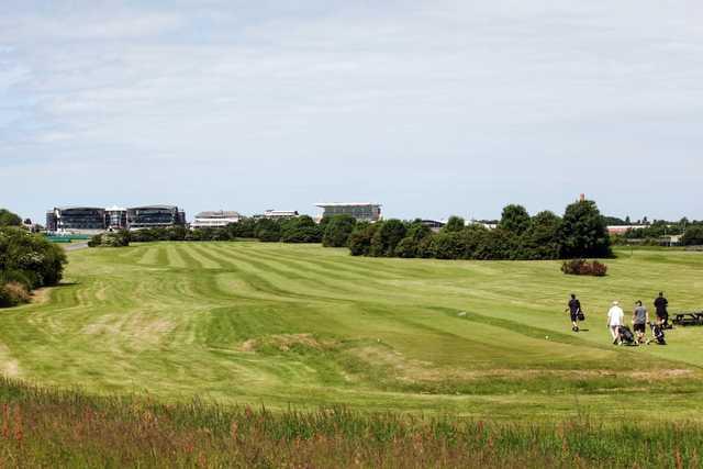 The stunning 9th hole with grandstand in the background at Aintree Golf Centre