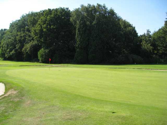 View of the 18th green in the sunshine at Northenden Golf Club 