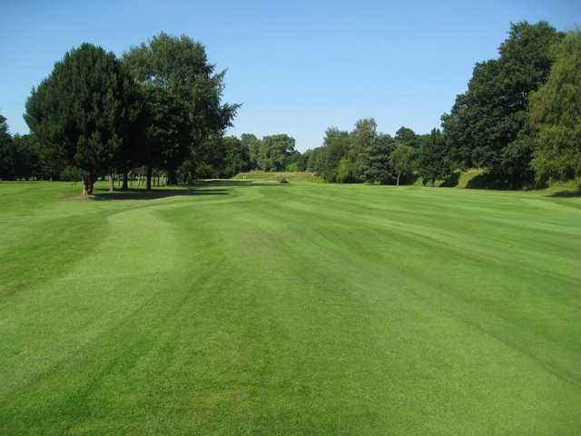 The tree lined 1st fairway at Northenden Golf Club 