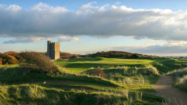 A view of hole #12 and the famous Church sitting inside the links at Championship Course from Burnham & Berrow Golf Club.