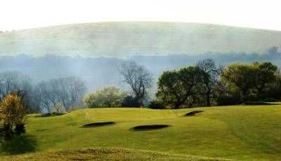 The multiple bunker defended 18th hole at Pyecombe