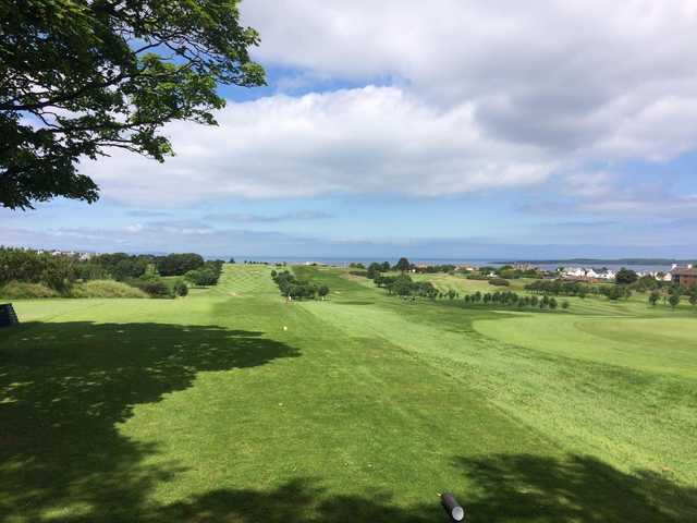 The 12th green in the distance with a seaview backdrop