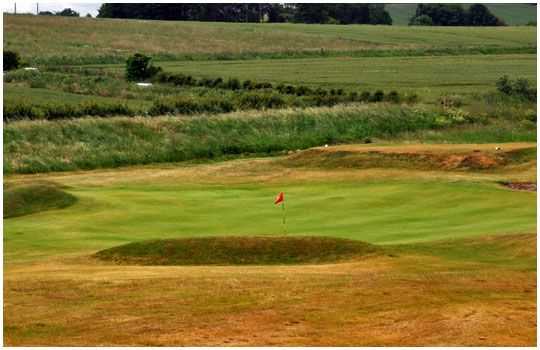 A bunker lined green at the Dunstanburgh Castle Golf Club