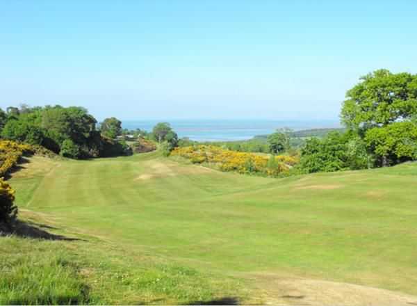 Sloping fairway on the 3rd hole from St Deiniol Golf Course